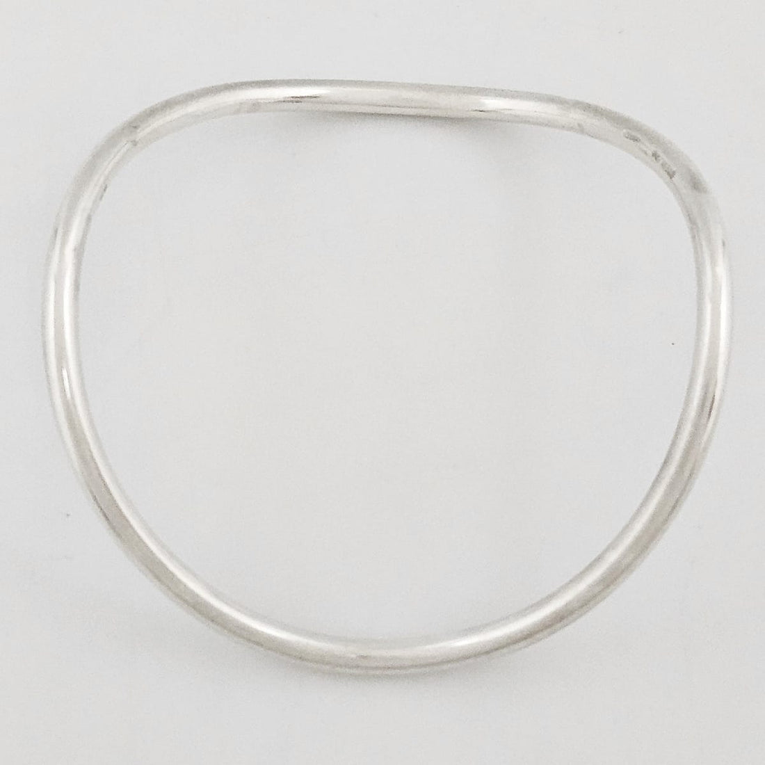Betty Cooke sterling silver modernist Wavy Tubular Bangle Bracelet Circa 1960s, view 1 of 7