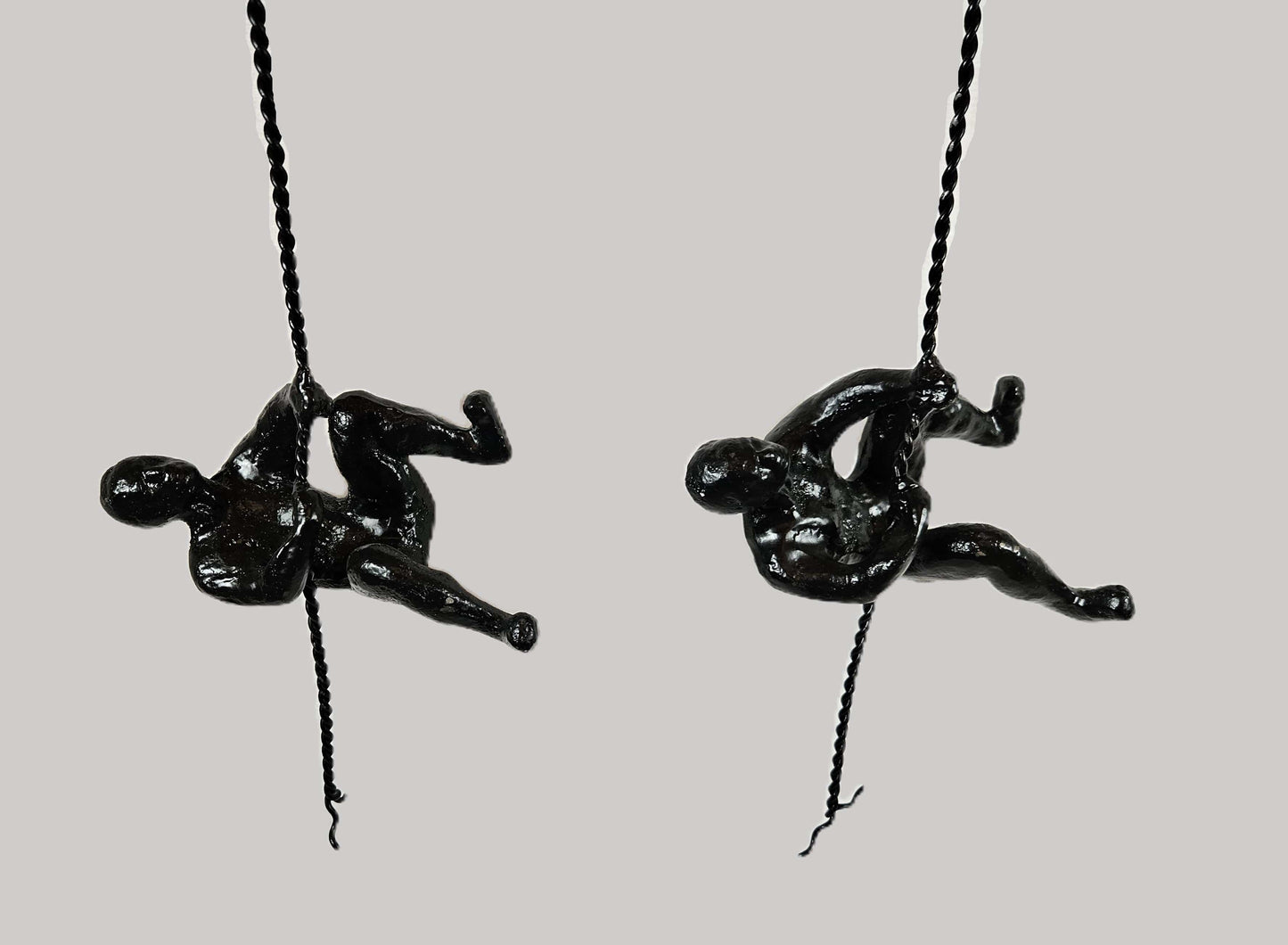 Global Views Artwork Global Views Matte Black Cast Iron Rock Wall Climber Men Wall Art Set of 2